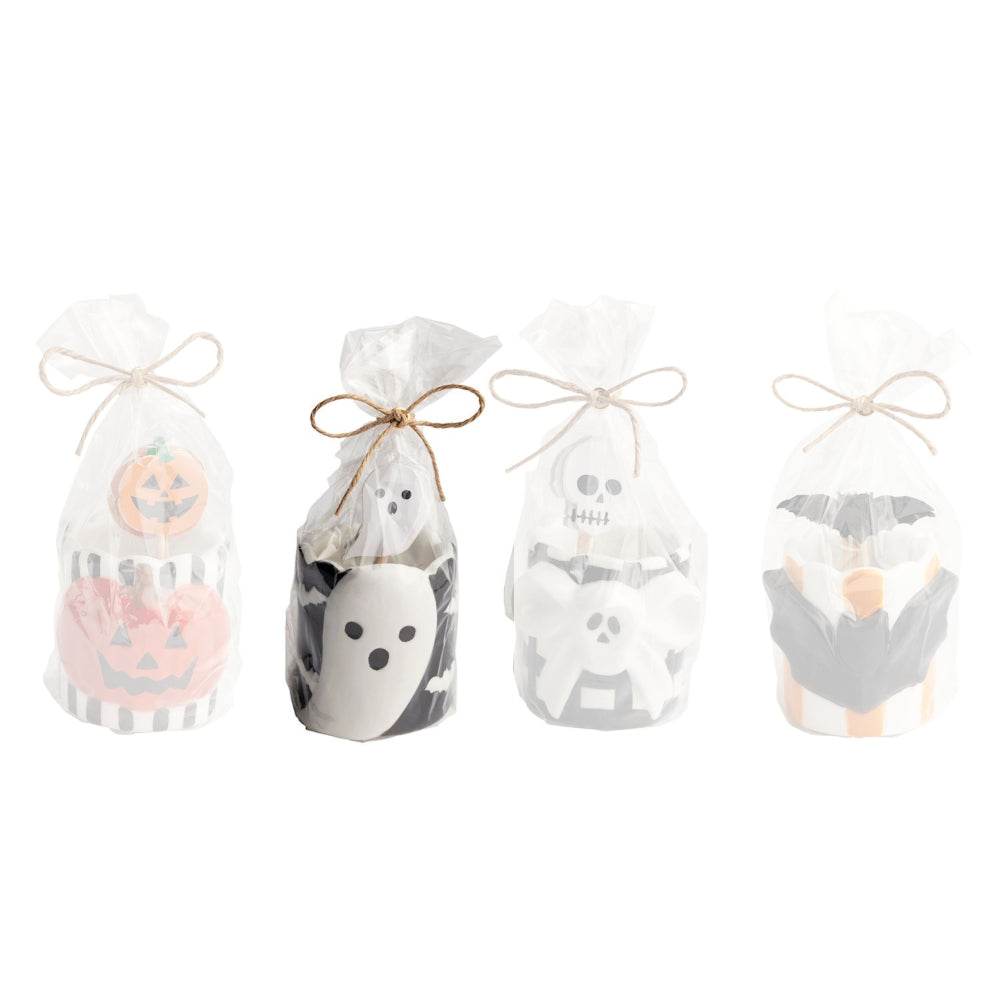 Ghost halloween-themed toothpick caddy set with a ceramic holder with a white ghost on the front with ghost themed toothpicks on a white backround. 