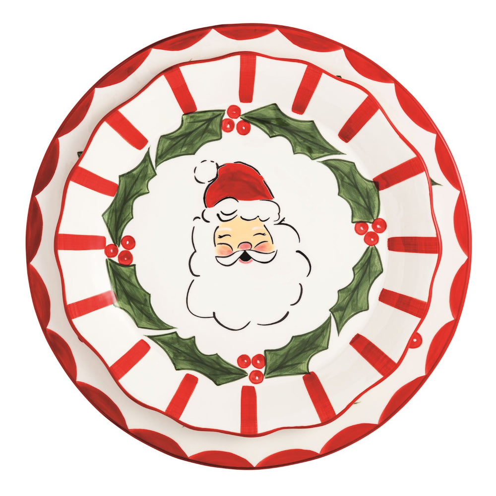 Decorative plate with Santa Claus face and holly design on a white background