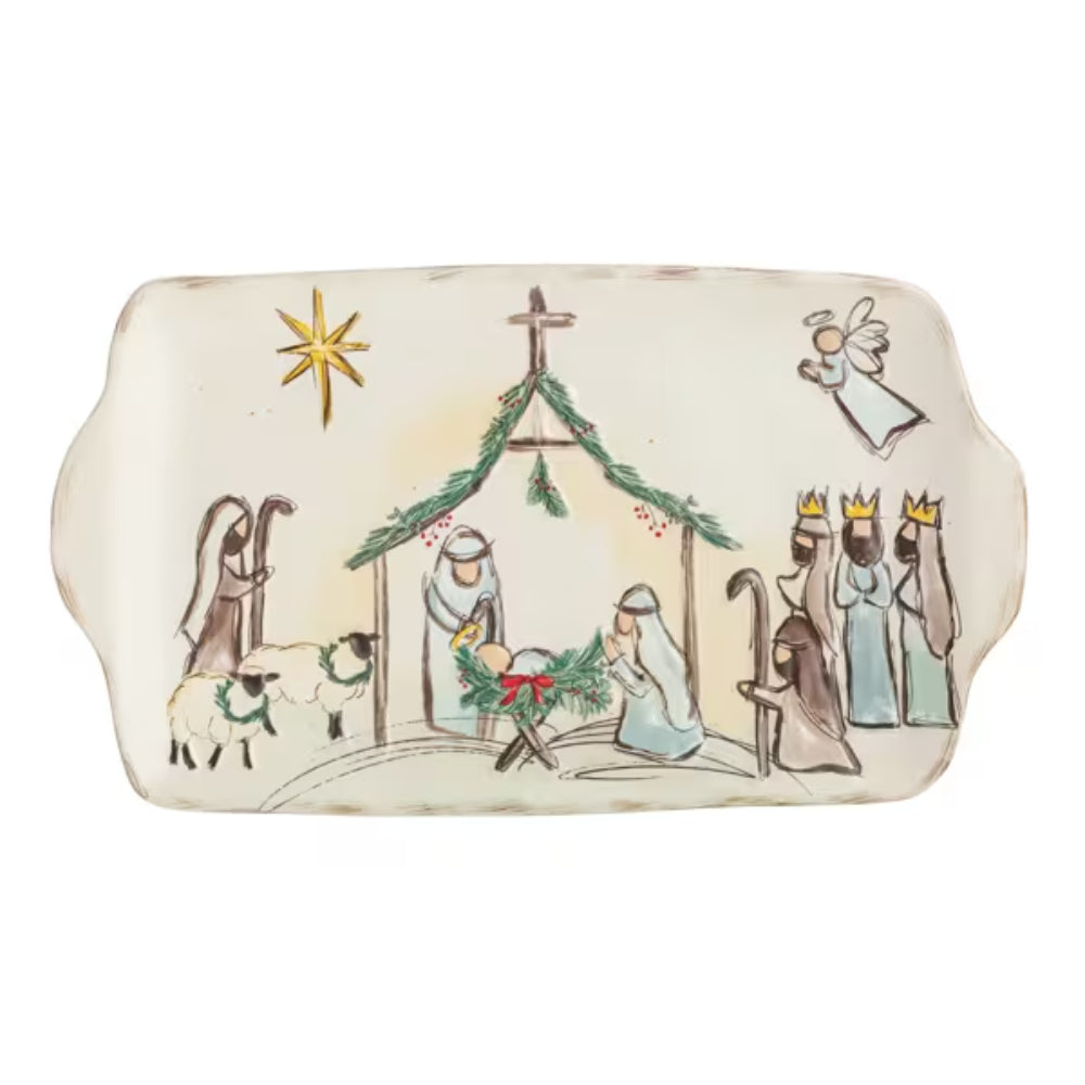 A rectangular ceramic Christmas nativity scene serving tray with scalloped edges, featuring painted figures, a stable, star, and angels on an off-white background.