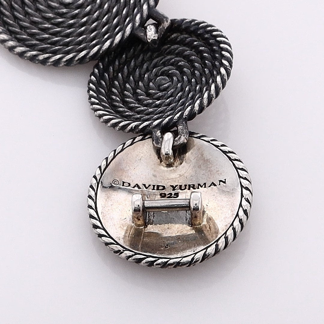 Silver David Yurman bracelet with circular coil links on a white background