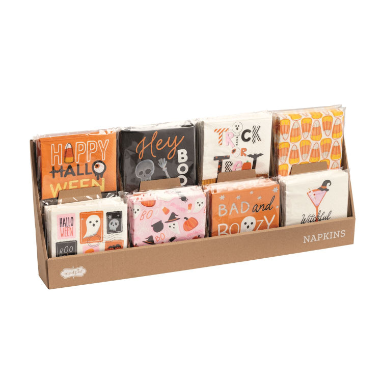 Display of Halloween-themed napkin packages in a cardboard holder.