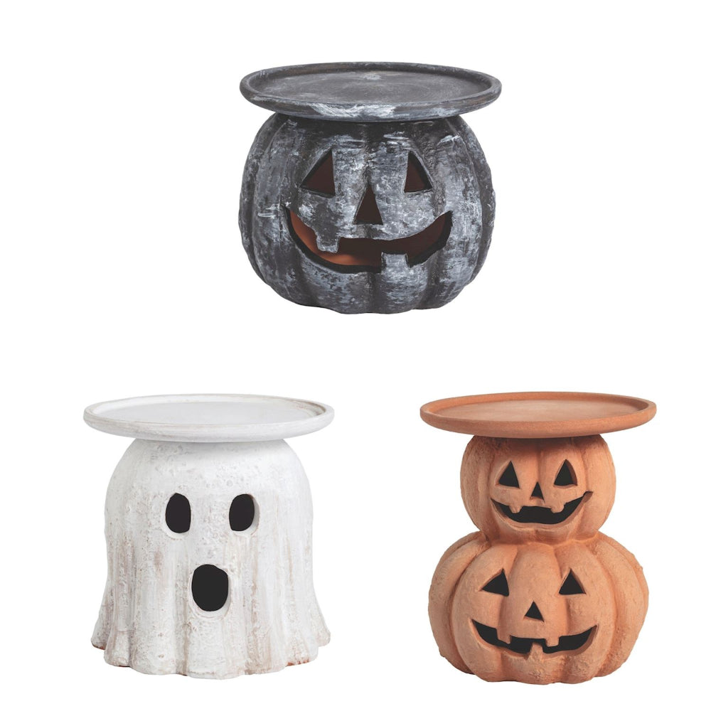 Three Halloween-themed candle holders shaped like a ghost, pumpkin, and jack-o'-lantern on a white background.