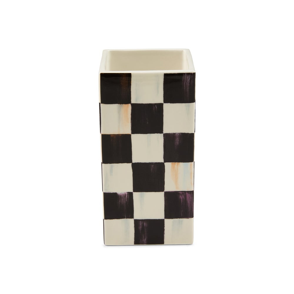 A rectangular ceramic vase with an open top, featuring a checkerboard pattern of black and off-white squares with subtle textured brushstroke details.