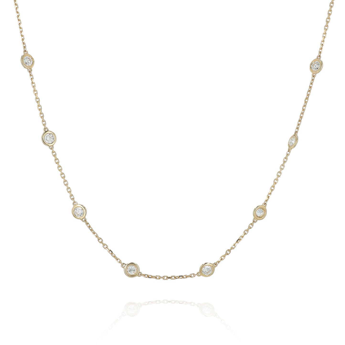 Yellow gold Diamonds By The Yard diamond station necklace on a white background