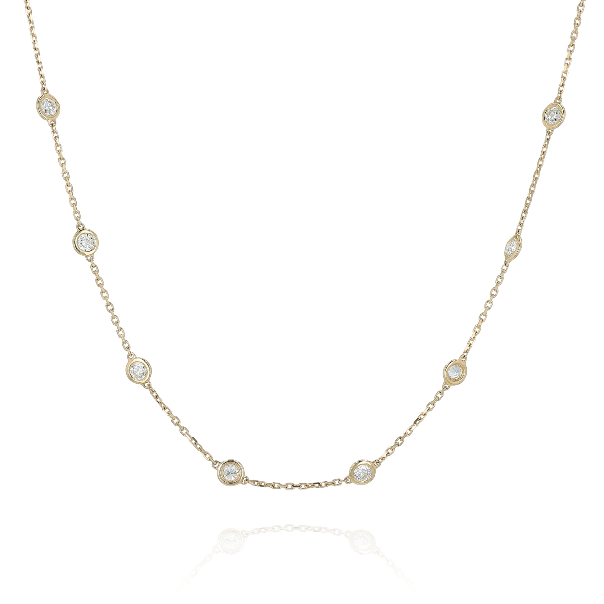 Yellow gold Diamonds By The Yard diamond station necklace on a white background