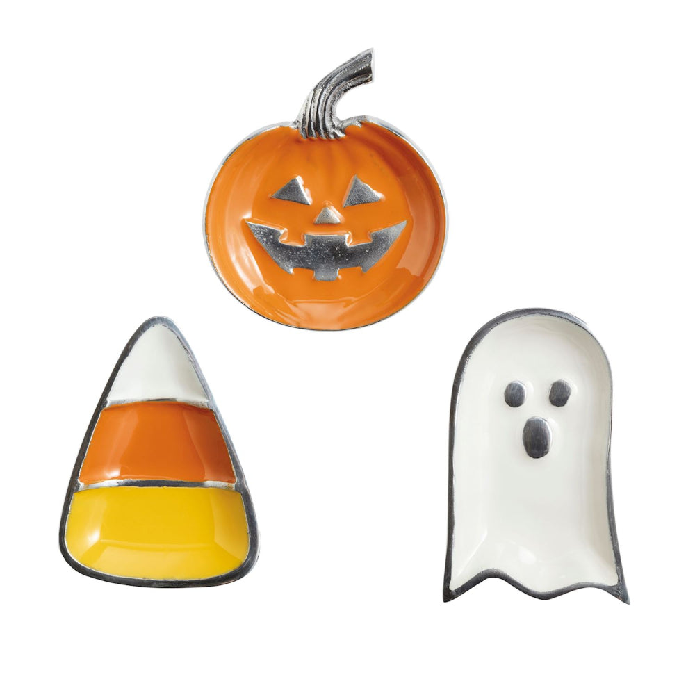 Three Halloween-themed trays: a pumpkin, candy corn, and ghost on a white background.