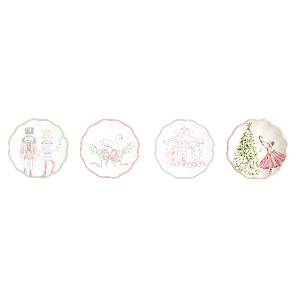 Four decorative ceramic plates with scalloped edges, each featuring a different whimsical illustration: a nutcracker, a swan, a carousel, and a dancing girl by a Christmas tree, shown on a plain white background.