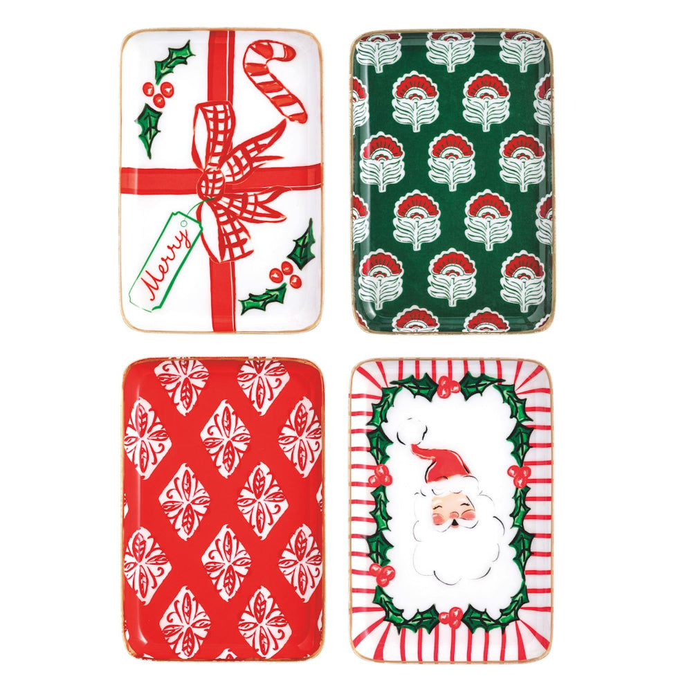 Four Christmas-themed plates with different designs on a white background.