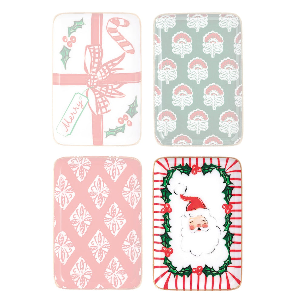 Four Christmas-themed plates with different designs on a white background.