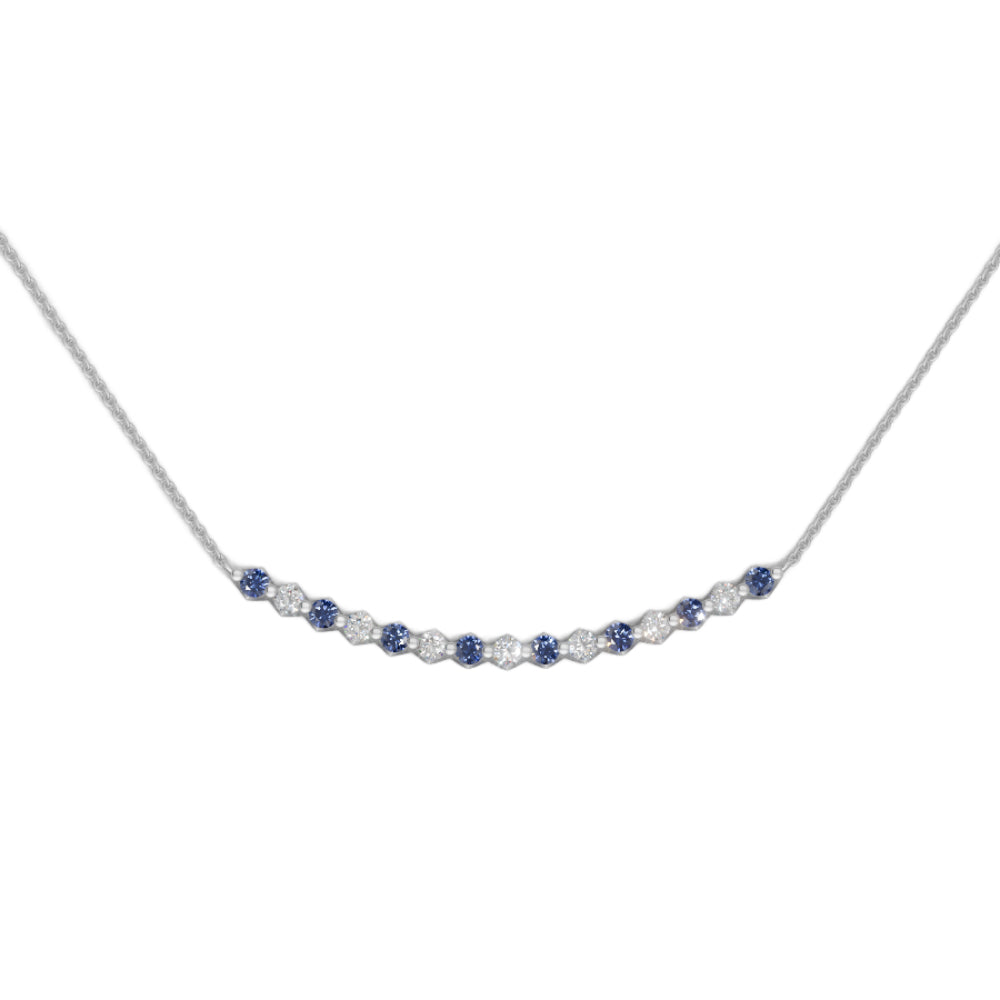 White gold sapphire and diamond smile pendant necklace with small diamonds on a white background