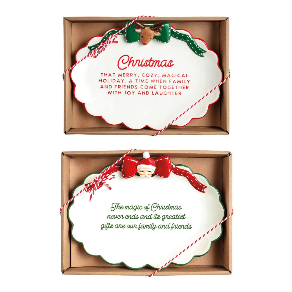 Two Christmas-themed decorative plates in cardboard packaging with Santa and reindeer designs.