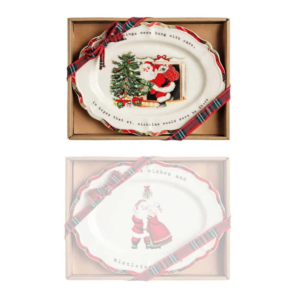 Two Christmas-themed plates in packaging with Santa Claus designs.