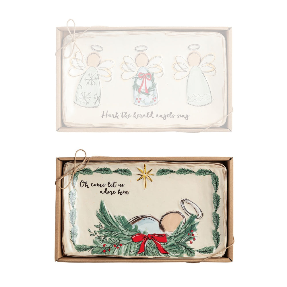 Two Christmas-themed pillowcases in packaging with angel designs and text.