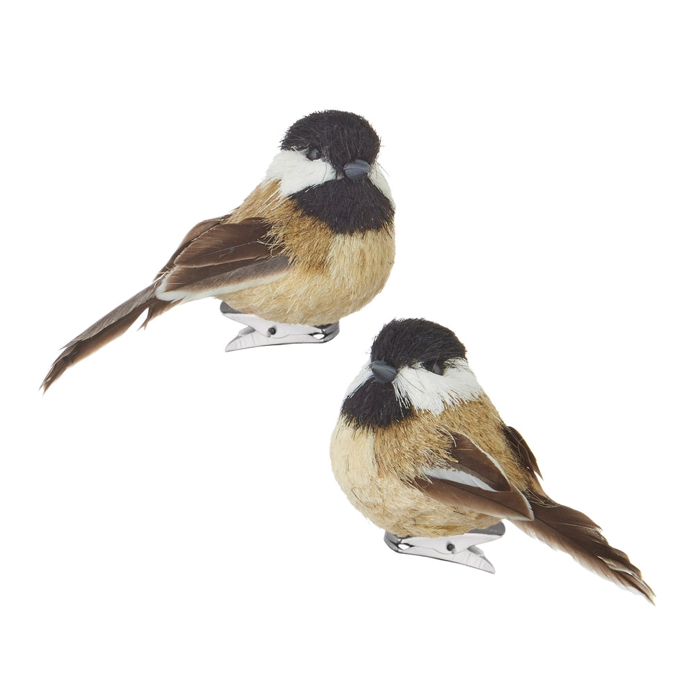 Two bird ornaments on a white background