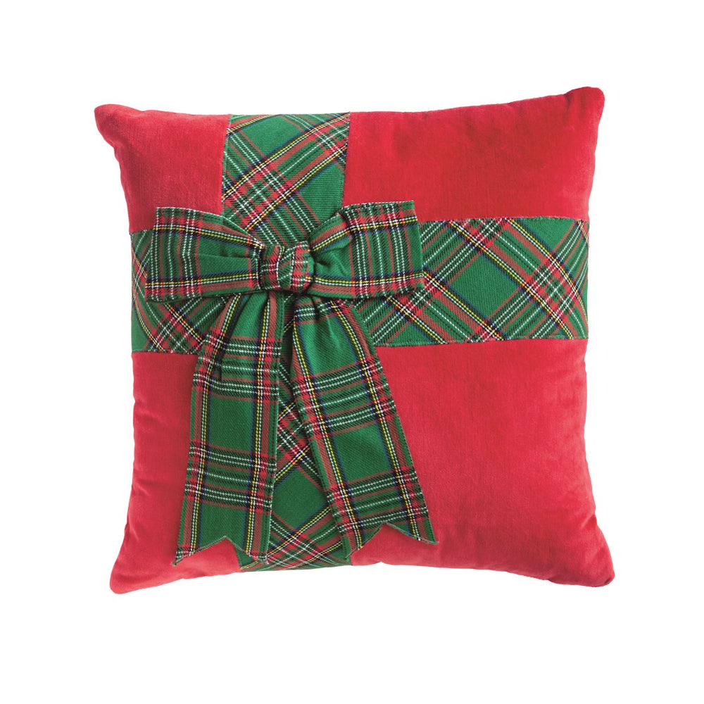 Red pillow with a green plaid bow on a white background