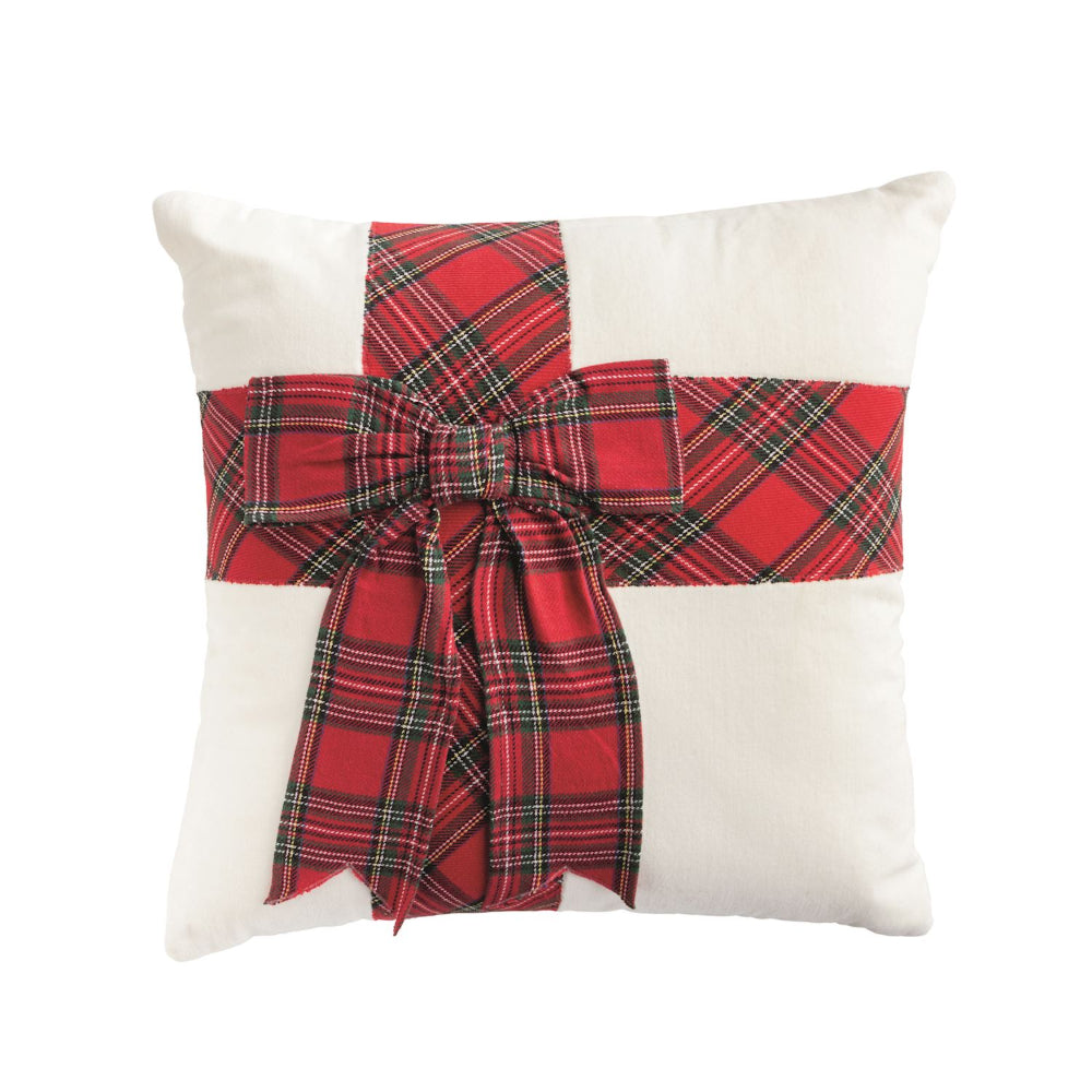 White pillow with a red plaid bow on a white background