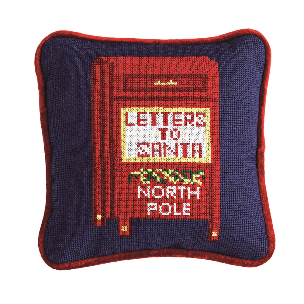 Decorative pillow with a red mailbox design and text on a blue background