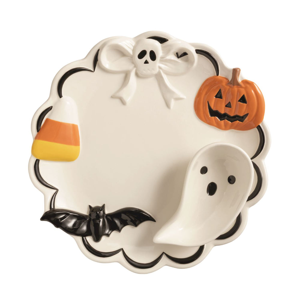 Decorative Halloween plate with ghost, pumpkin, candy corn, and bat designs on a white background.