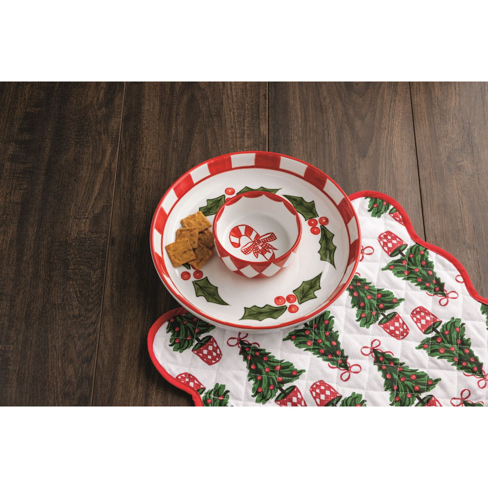 Christmas-themed plate with a candy cane design on a wooden surface