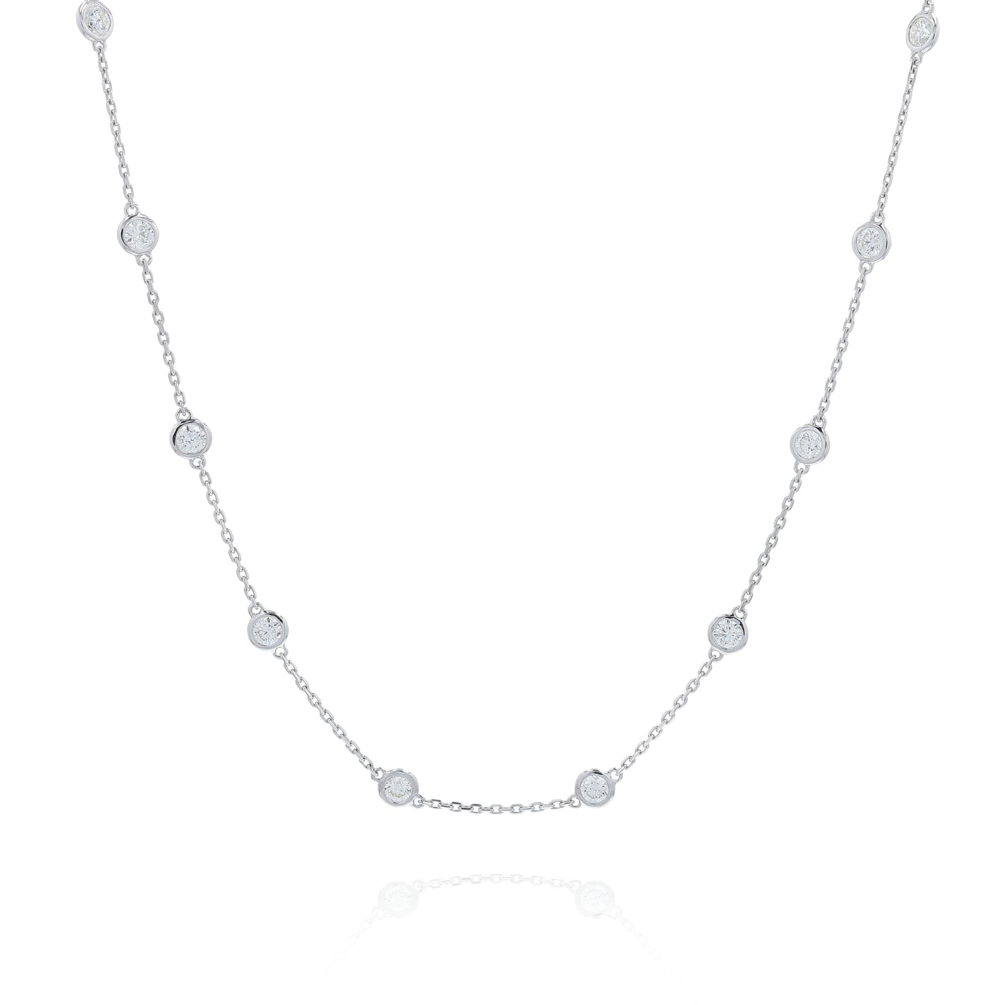 White gold bezel set Diamonds By The Yard station necklace on a white background