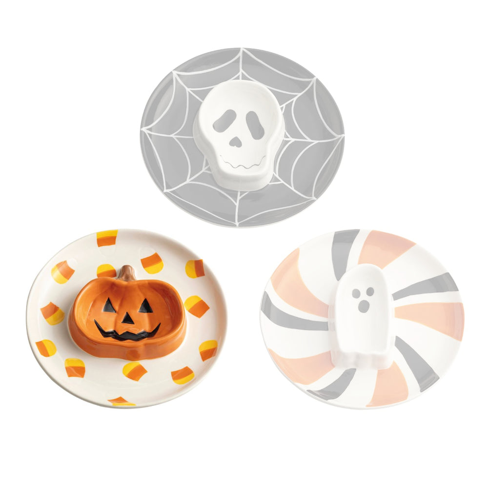 Three Halloween-themed plates with skull, pumpkin, and ghost designs on a white background.