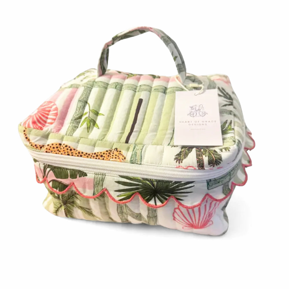 Cosmetic bag set with green and pink quilted designs on a white background