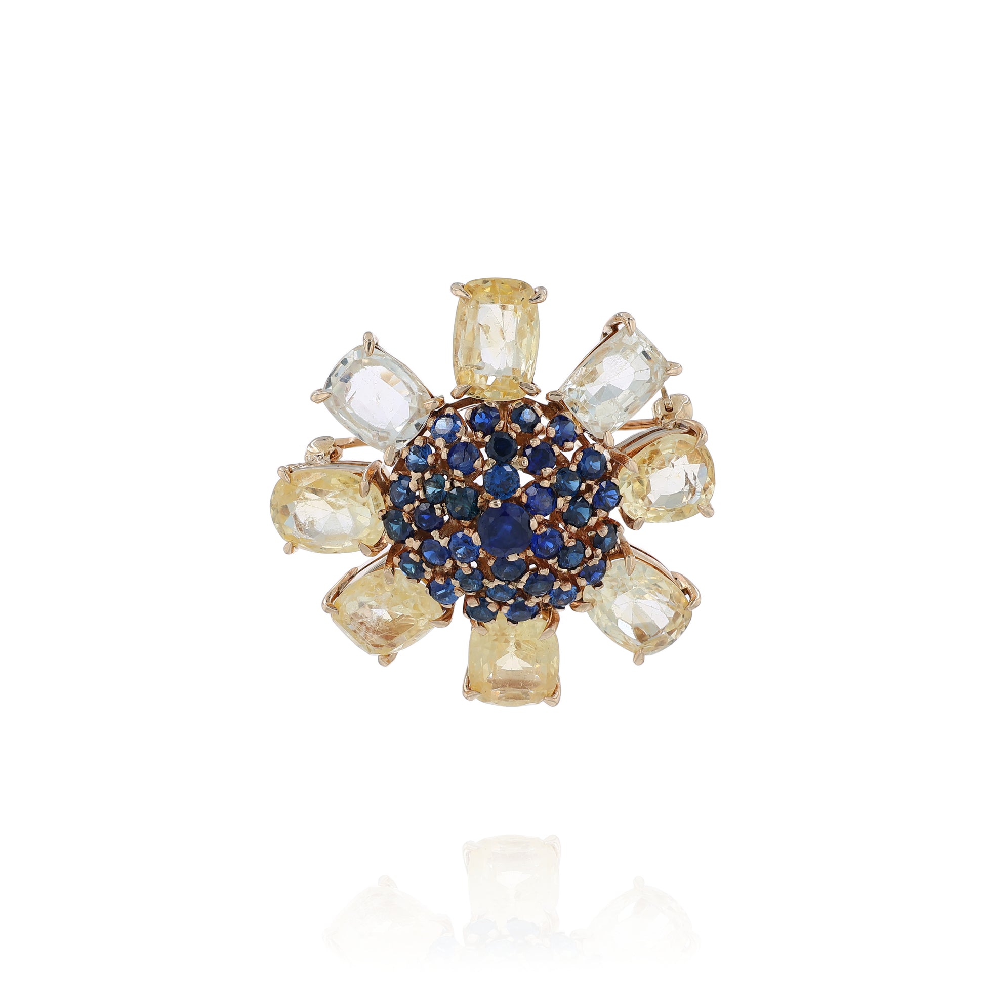 Yellow gold flower pin & pendant with outer yellow sapphires and inner blue sapphires on a white background