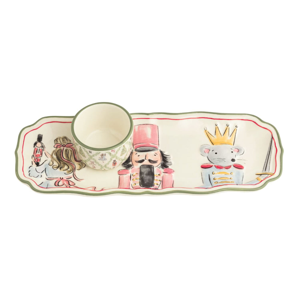 Decorative ceramic tray with illustrations of characters from a Nutcracker story on a white background.