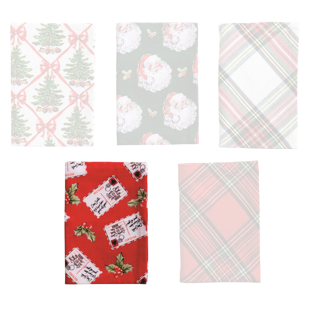 A holiday-themed red towel with a postcard design and green holly branches on a white backround. 