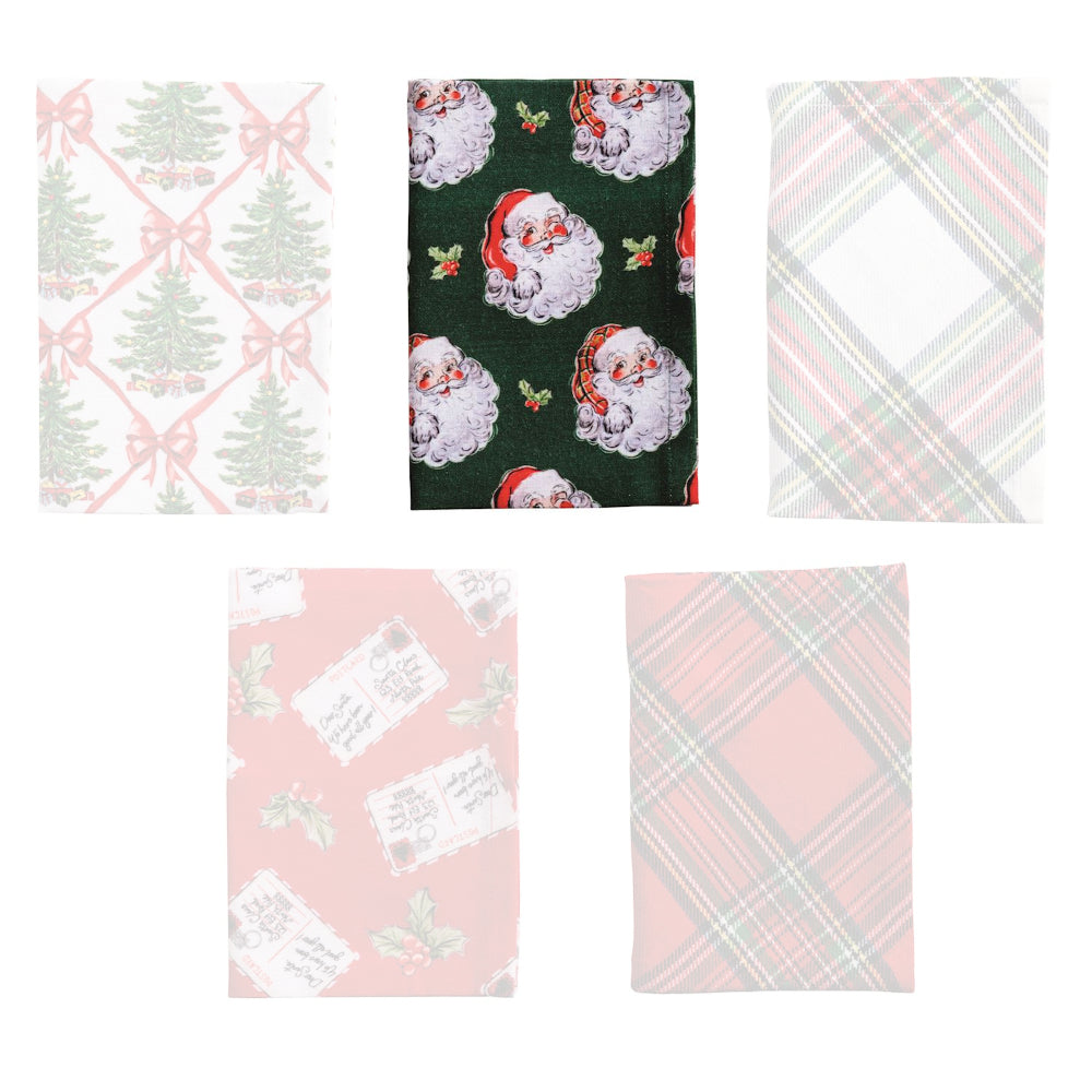 A holiday-themed print christmas tree towels with bows and santa faces on a dark green background. 