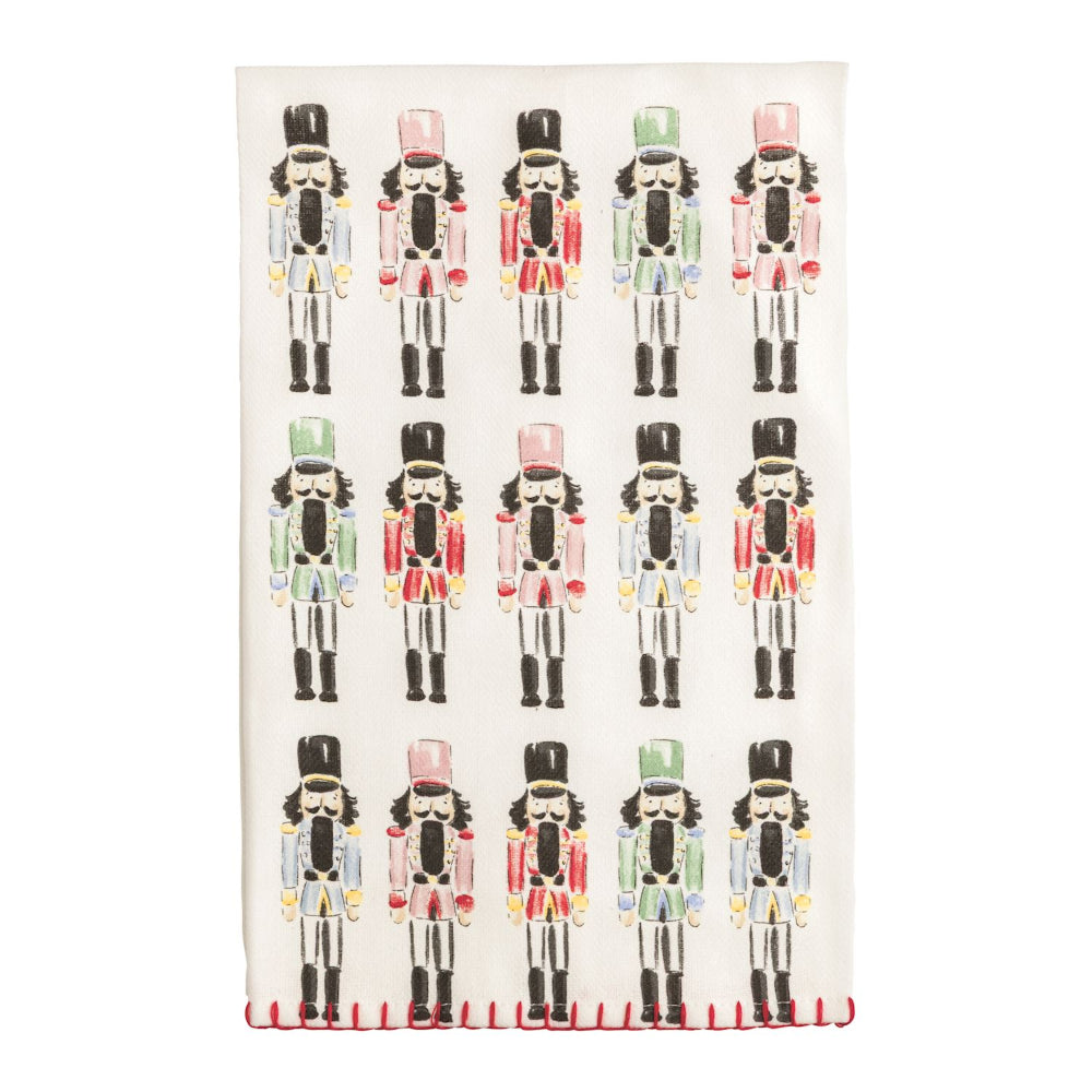 Patterned kitchen towel with nutcracker design on a white background