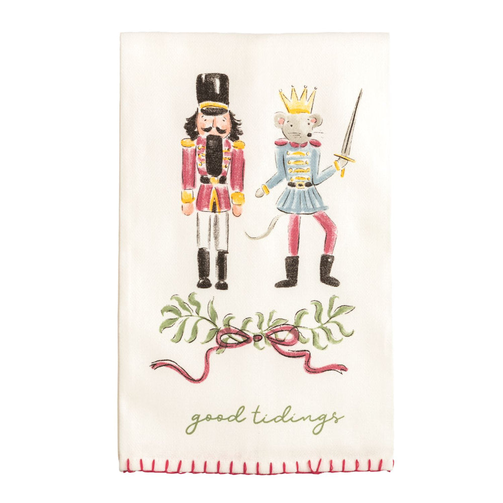 Decorative kitchen towel with nutcracker and mouse king illustration and 'good tidings' text.