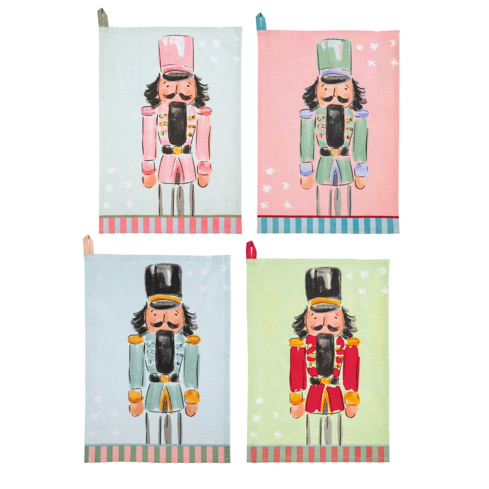 Four decorative kitchen towels with nutcracker designs on a white background