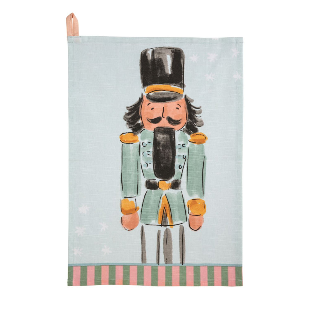 Tea towel with a nutcracker design on a light blue background
