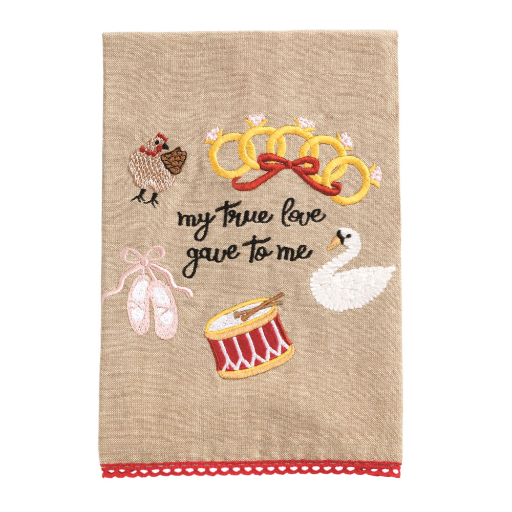 Decorative towel with embroidered elements and text on a beige background