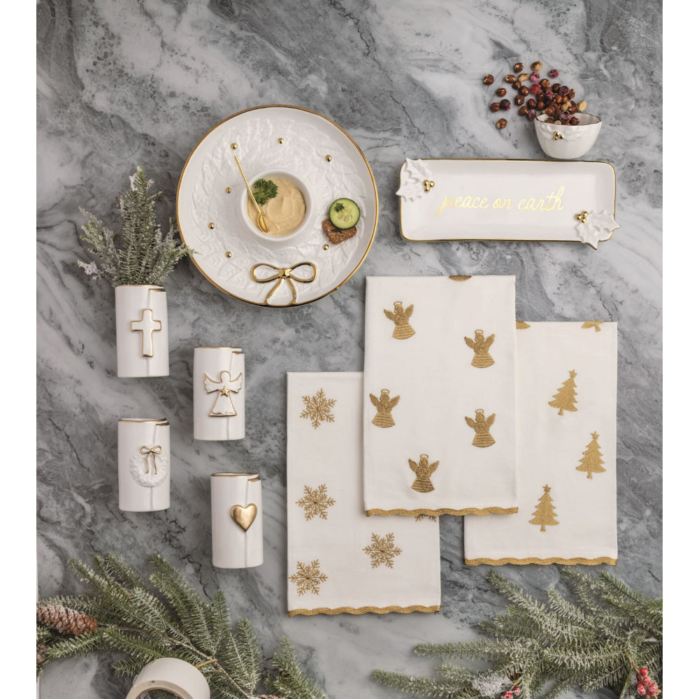 Decorative tableware set with gold accents on a marble surface