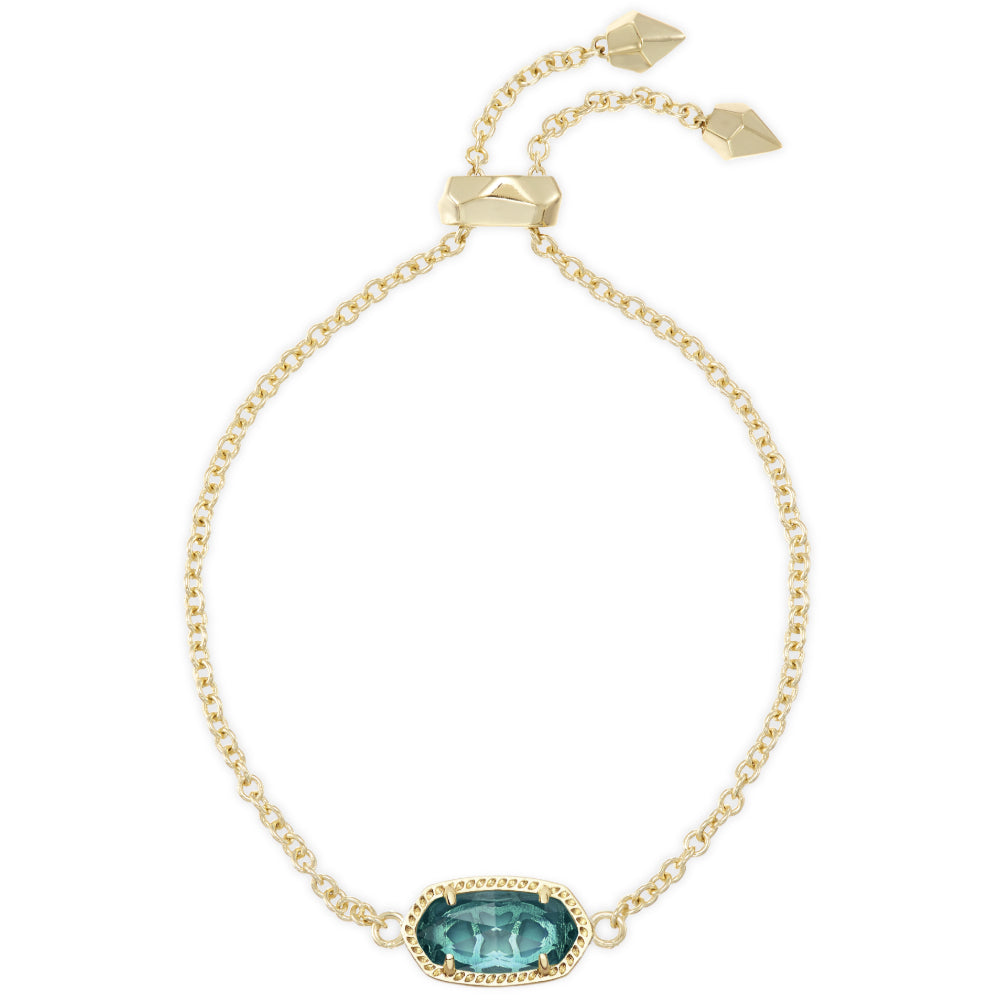 A delicate gold chain bracelet featuring a central oval bezel-set teal gemstone and a matching gold adjustable toggle clasp with two small dangling tags, shown on a plain white background.
