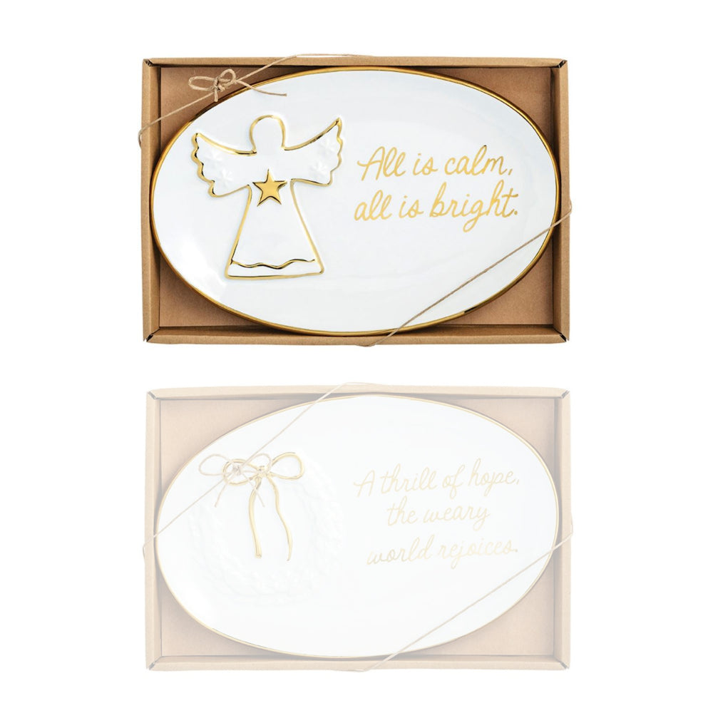 Decorative plate with angel design and text 'All is calm, all is bright' in a box packaging.
