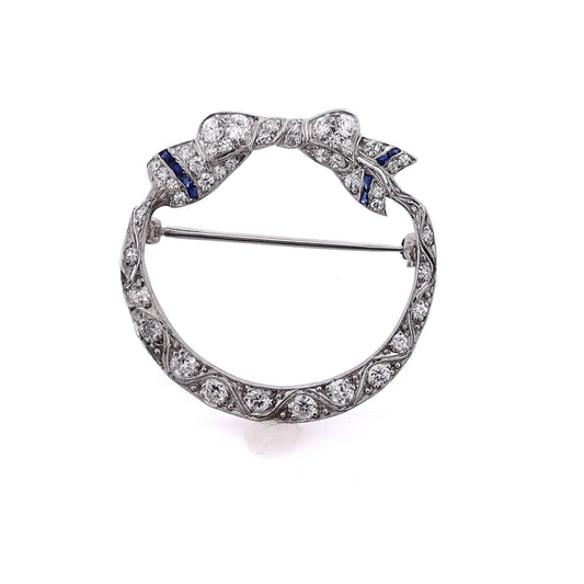 Estate Platinum Bow Design Diamond and Synthetic Sapphire Circle Pin