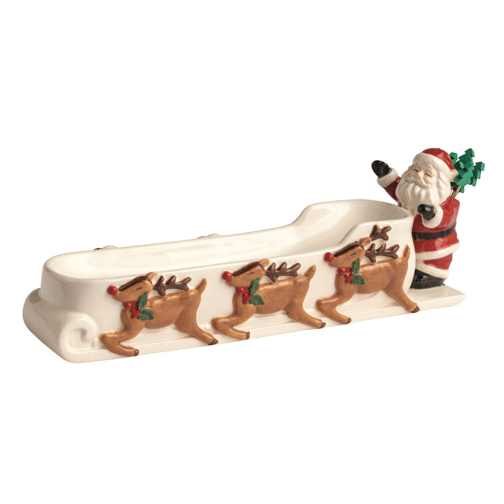 Decorative figure of Santa Claus with reindeer on a white background