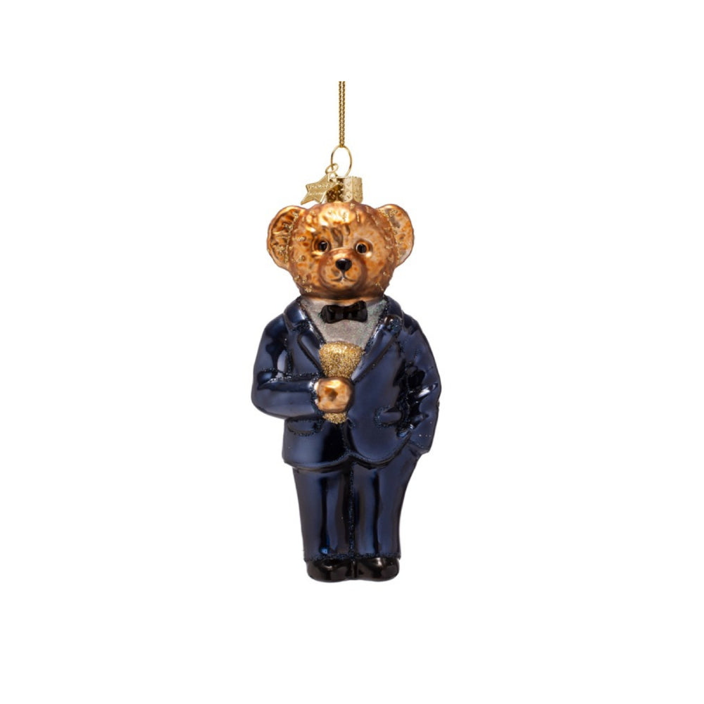 Teddy bear ornament in a blue suit with a white shirt and black bow tie on a white background