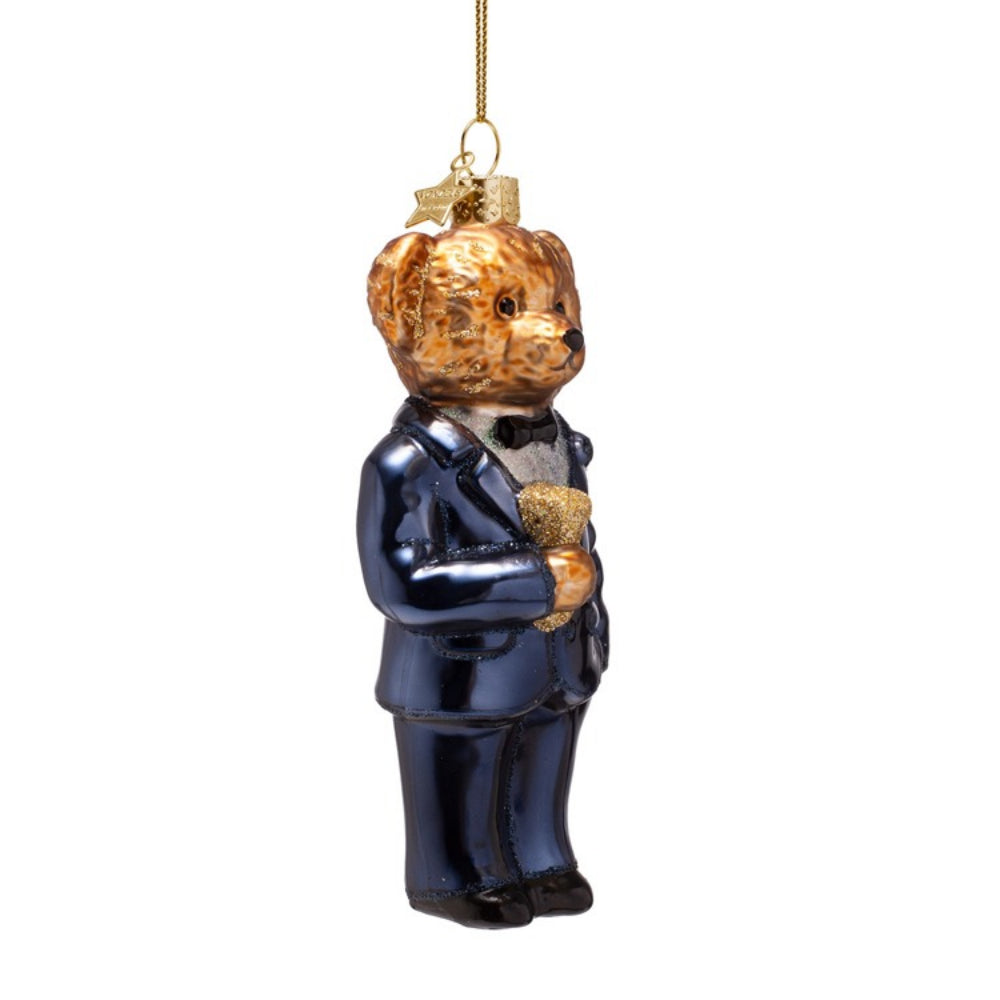 Glass bear ornament in a suit holding another bear, hanging on a white background