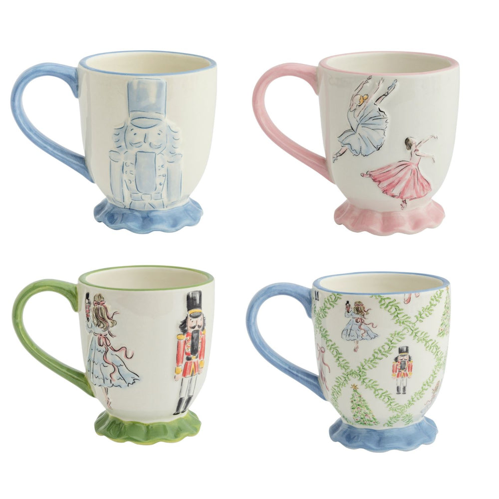 Four decorative mugs with nutcracker designs on a white background