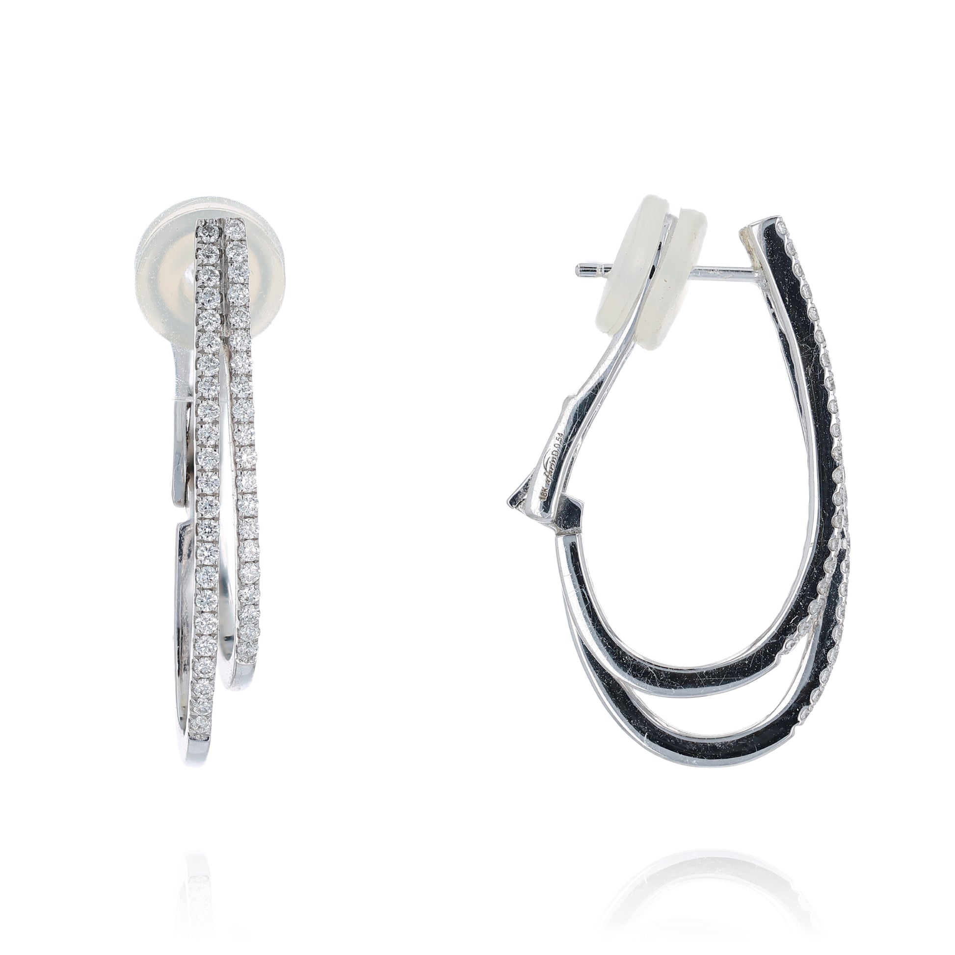 Pair of white gold 2 row diamond hoop earrings on a white background