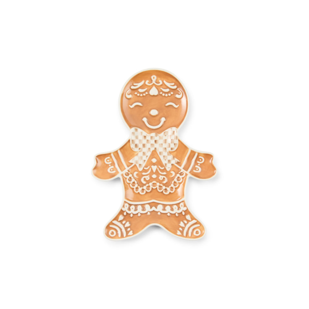 A gingerbread man spoon tray with white icing-style patterns, set against a plain white background.