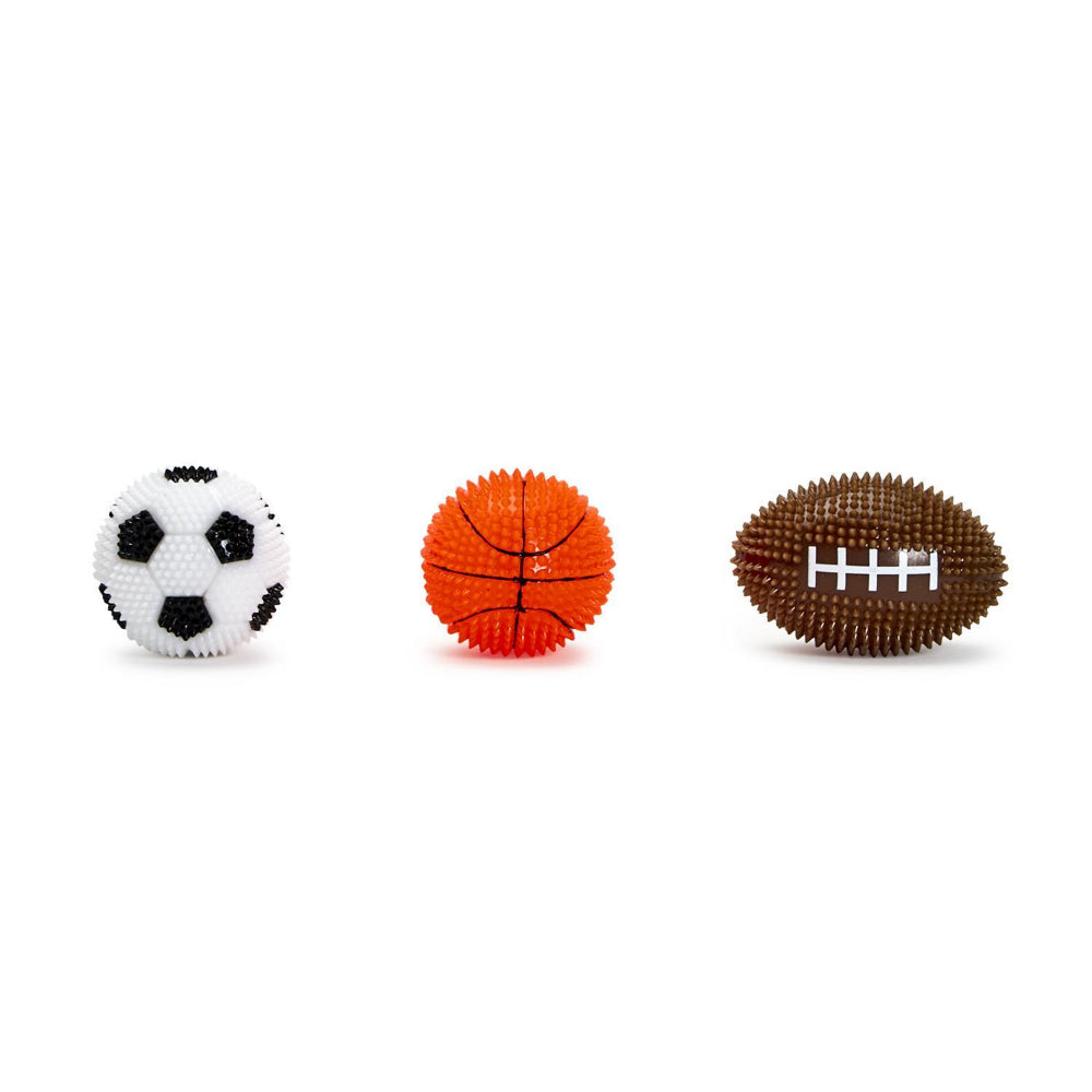 Three toy balls resembling a soccer ball, basketball, and football on a white background.