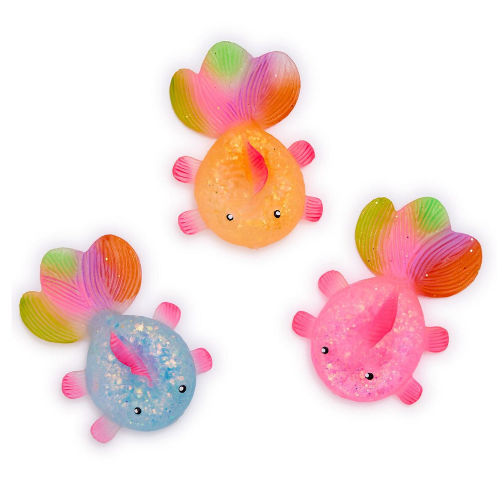 Three colorful fish-shaped toys with rainbow tails on a white background