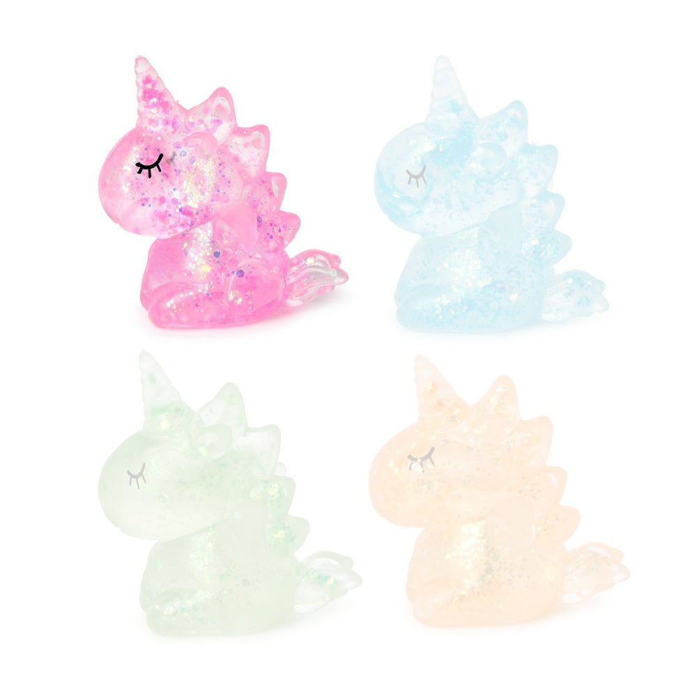 Pink squishy glittery unicorn toy on a white background