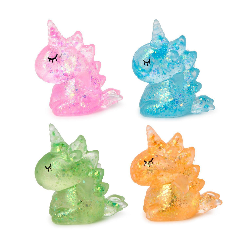 Four colorful  squishy glittery unicorn toys on a white background