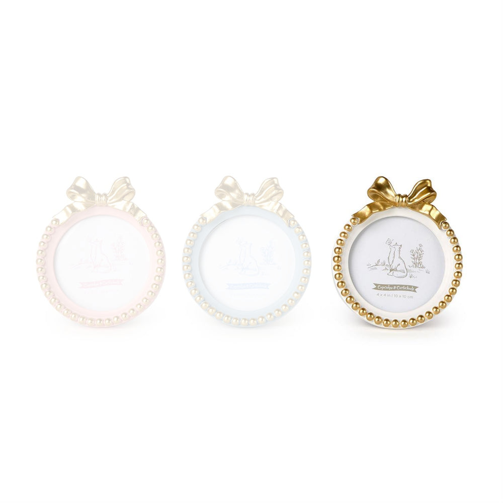 White round golden bow picture frame with a decorative bow and bead trim on a white backround. 